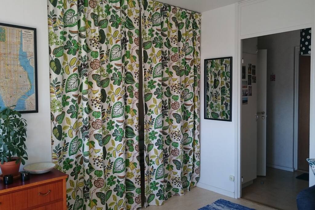 Part of the main room (alcove behind drapes) and hall.