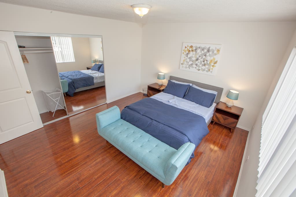 Full-length mirror with iron, ironing board, hangers, etc.
