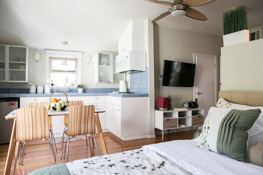 main sleeping area facing the kitchenette & breakfast/work table
