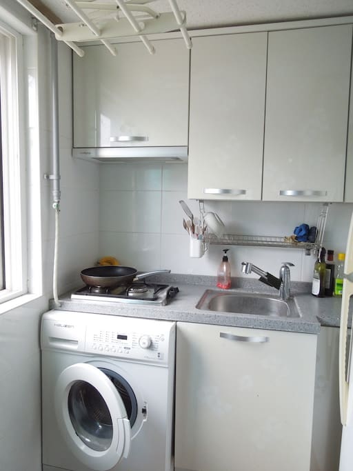 Bright, modern, clean kitchen, large fridge, microwave oven, toaster and kettle