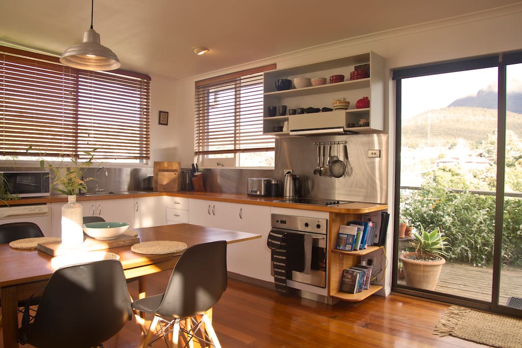 Fully equipped kitchen with oven, stove, dishwasher, microwave, fridge, and tea and coffee making facilities including a coffee grinder, french press and aeropress. Our dining area connects with a sliding door to outdoor deck where a second table if set up if you'd prefer to have your meals outside to take in the view.