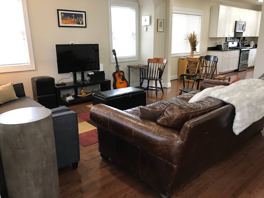 Living room; super comfy leather couch and a sleeper sofa. Feel free to do some binge-watching.