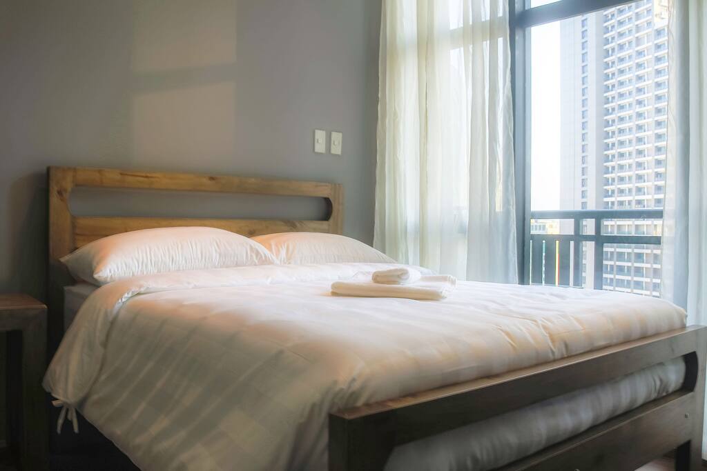 Fluffy pillows and duvet wrapped on top of Ambassador mattress. Hotel linens for your sleeping comfort.