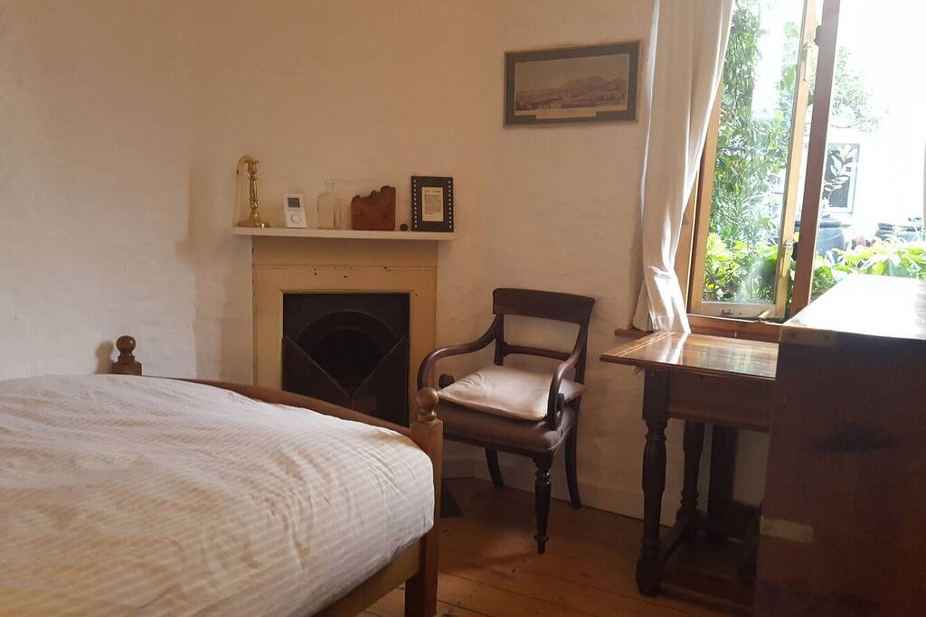 It's a smallish bedroom but pretty; it's super-quiet with a window onto the garden terrace.