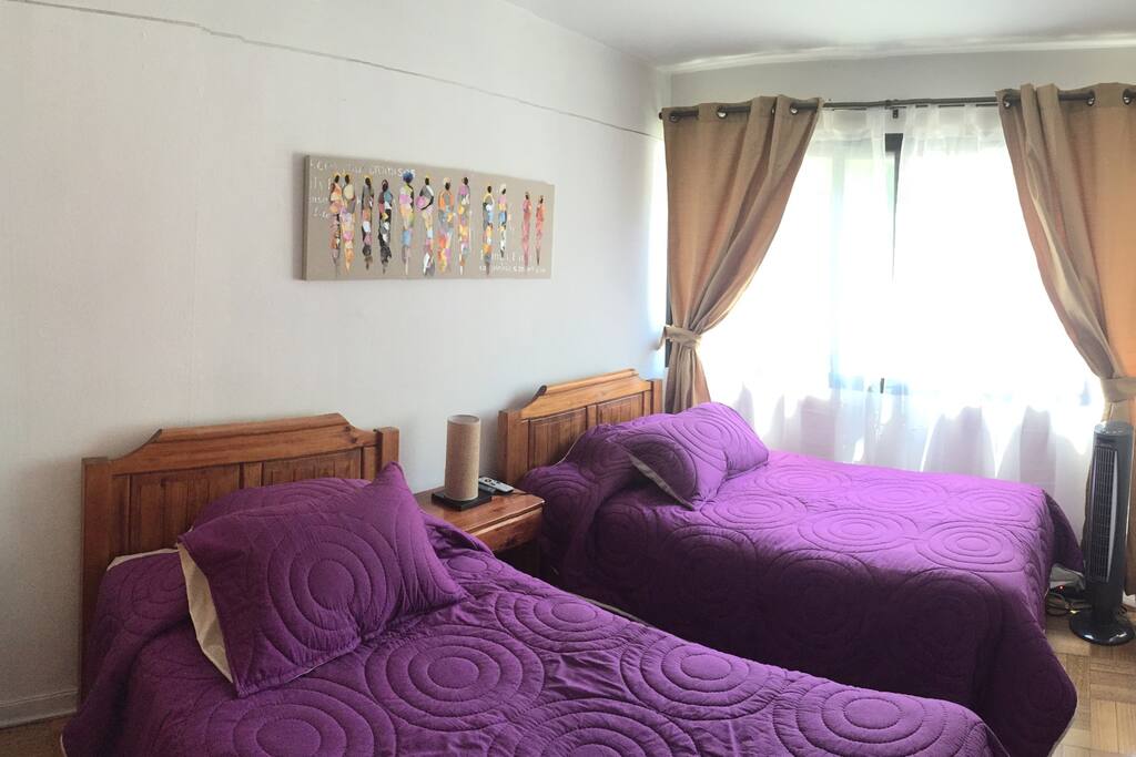 We have 2 comfortable beds with a private closet, an LCD of 32" with satellital connection, a frigobar and a fan to refresh the room. / Tenemos 2 camas cómodas con closet privado, un LCD de 32" con televisión satelital, un frigobar y un ventilador para refrescar la habitación.