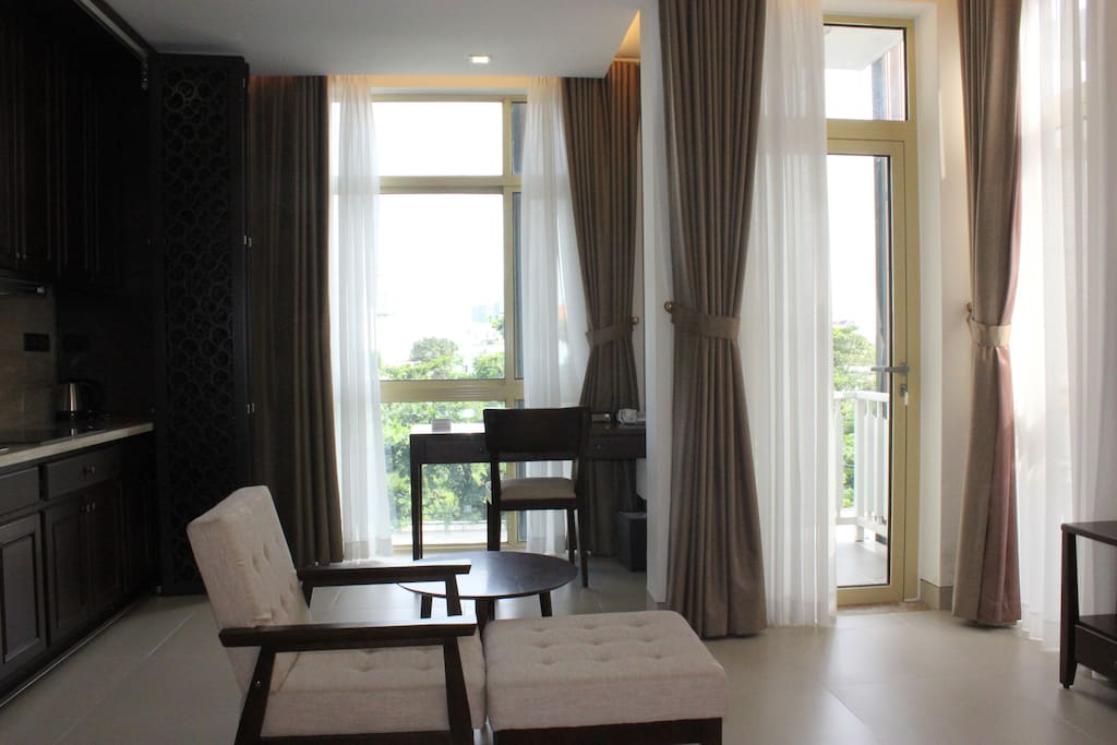 Great little space with lots of light. Kitchen on the left, TV on the right, balcony over forward to the right.