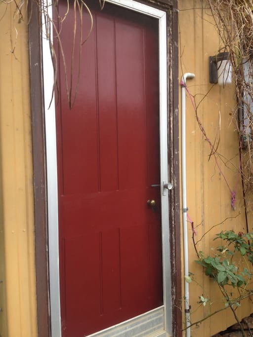 Cabin entrance via recently installed one hundred and seventeen year old door with two brass barrel keys