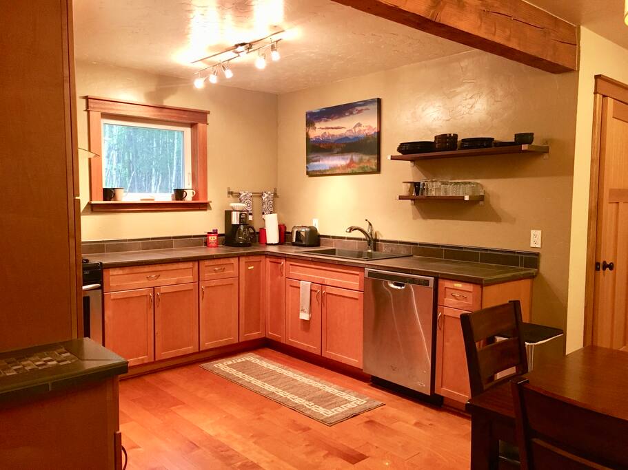 Kitchen with stainless steel appliances incl. dishwasher