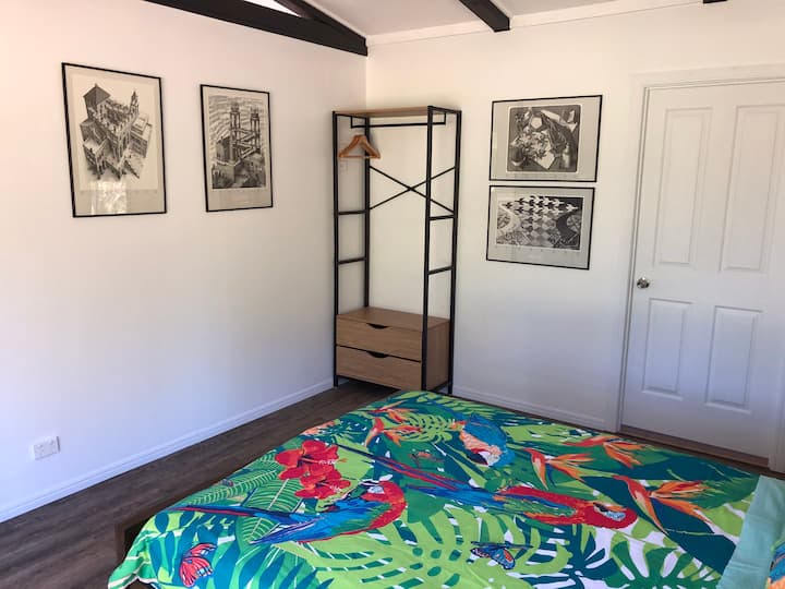 Queen bed with 4 M. C. Escher prints to enjoy