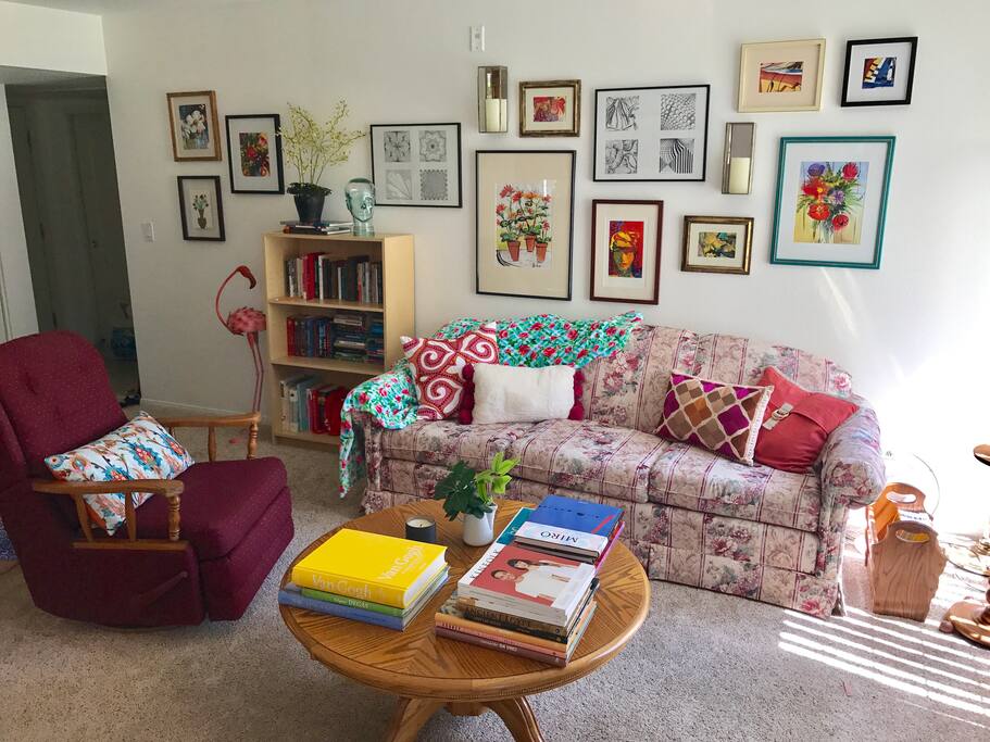 The living room filled with original art by your hostess.