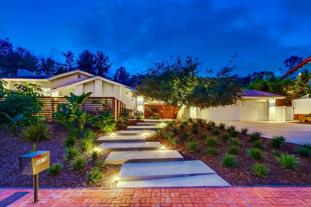 Entryway from street with large driveway for parking