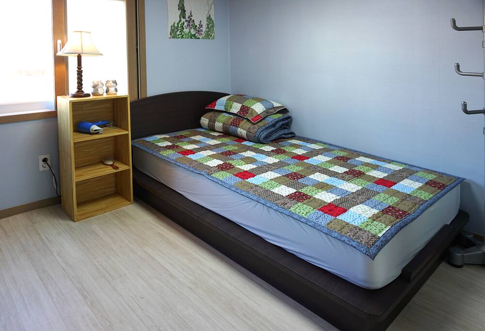 one single bed in a room