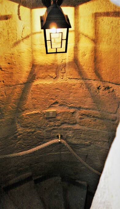 The 15 century stone spiral staircase leading to Le Grenier