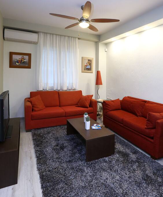 Couch, sofa-bed and do notice the 'oldie-looking'ceiling fan