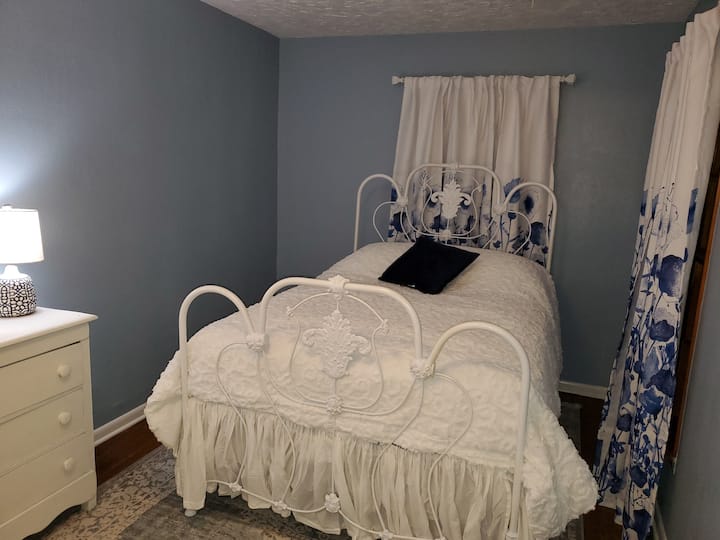 It may be a small room but it is so cozy!  This is my favorite bedroom in the house. 