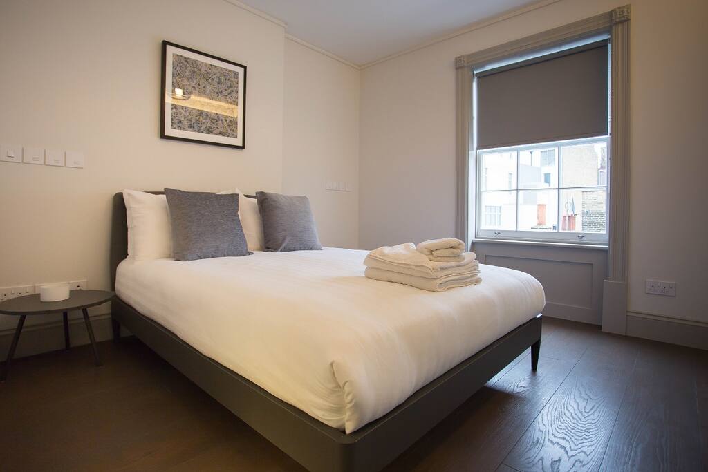 King size bed, back facing double glazed windows, big fitted LED lit Italian closets