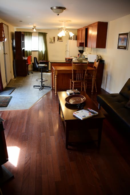Coffee table top lifts to double as work surface or eating area. Sofa folds down into firm support double bed