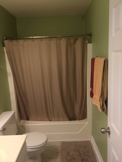The bathroom is well-equipped with top-shelf linens and toiletries.