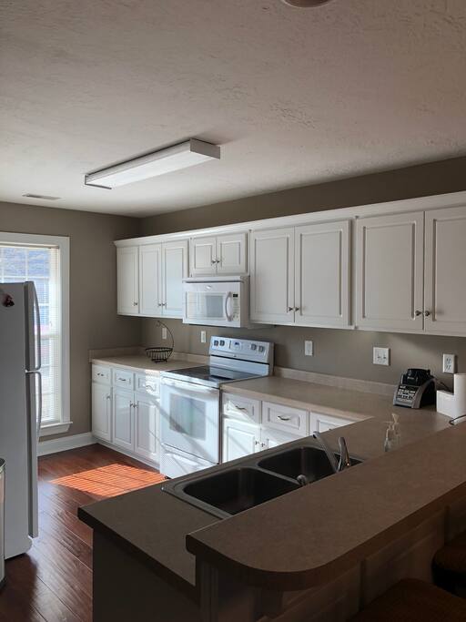 Kitchen with toaster, coffee pot, ninja blender