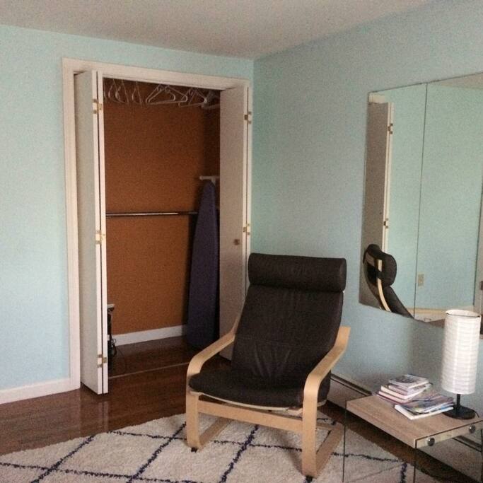 Big closet with many hangers.