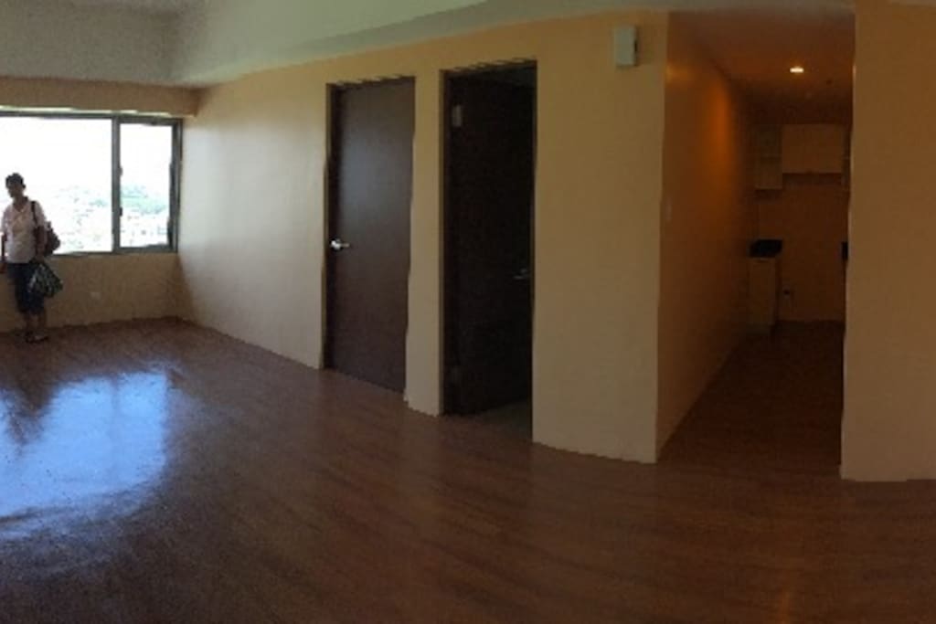 View of Living Room; doors to Bedroom and Toilet; entrance to Kitchen.