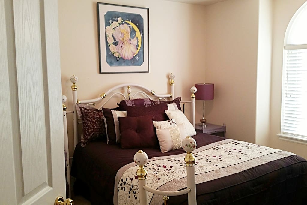 **BEAUTIFUL QUEEN "PURPLE ROOM" with queen brass bed, matching mirrored dresser and chair for changing. This room also has a closet for guest use.