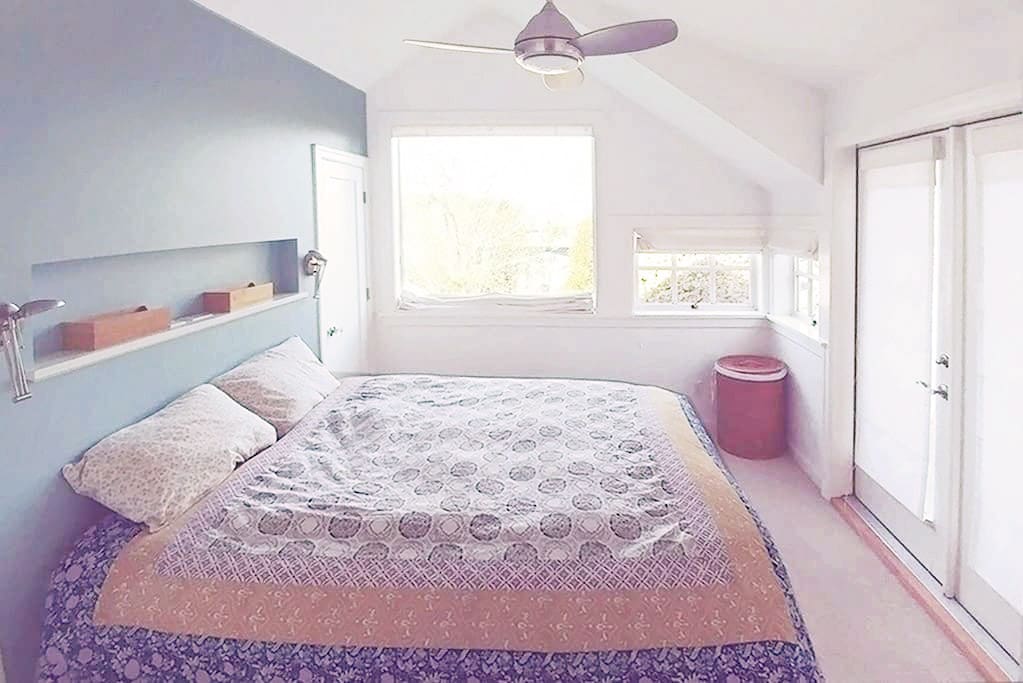 Master bedroom features a queen-sized bed and private bathroom attached.