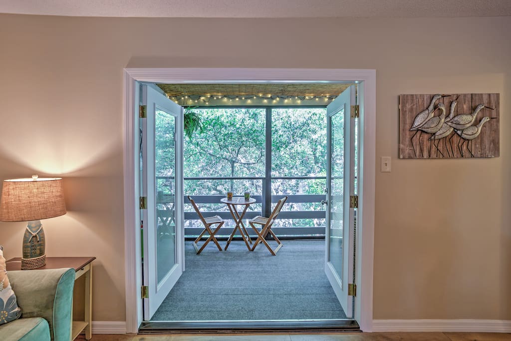 Large french doors lead out to a marvelous screened-in patio.