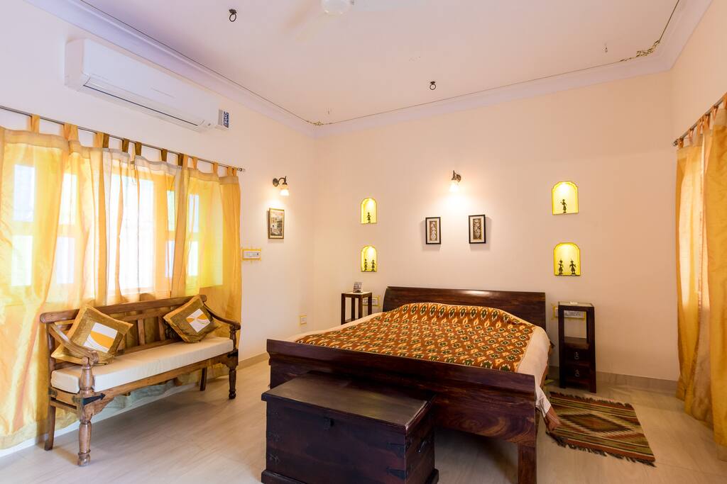 R.No. 2 - Side View of the King Size Bed along with a beautifully carved sitting bench.