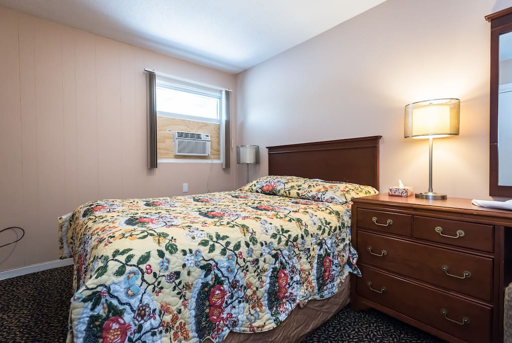 Queen bed in one of the rooms.