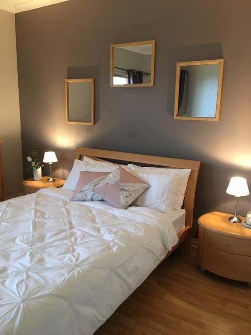 Enjoy the views from this spacious bedroom with Q/Bed named Oceanside Sanctuary, adjacent to ensuit