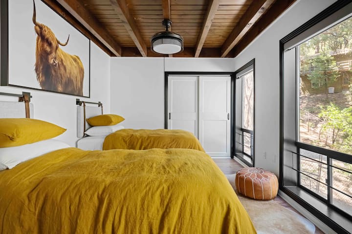 Highland inspired room with two twin beds.