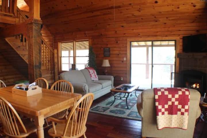 Sitting area with gas logs, TV with DVD player, XM Radio, and landline phone.  Please note: We are semi-off the grid so no wi-fi, no cable/satellite service and no cell service.  We have several board games, card games and DVDs for your enjoyment.