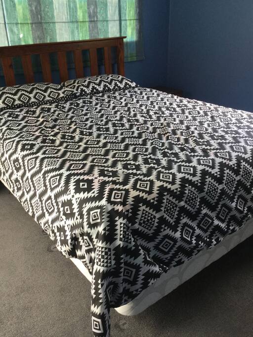 Upstairs bedroom with comfortable Queen Bed