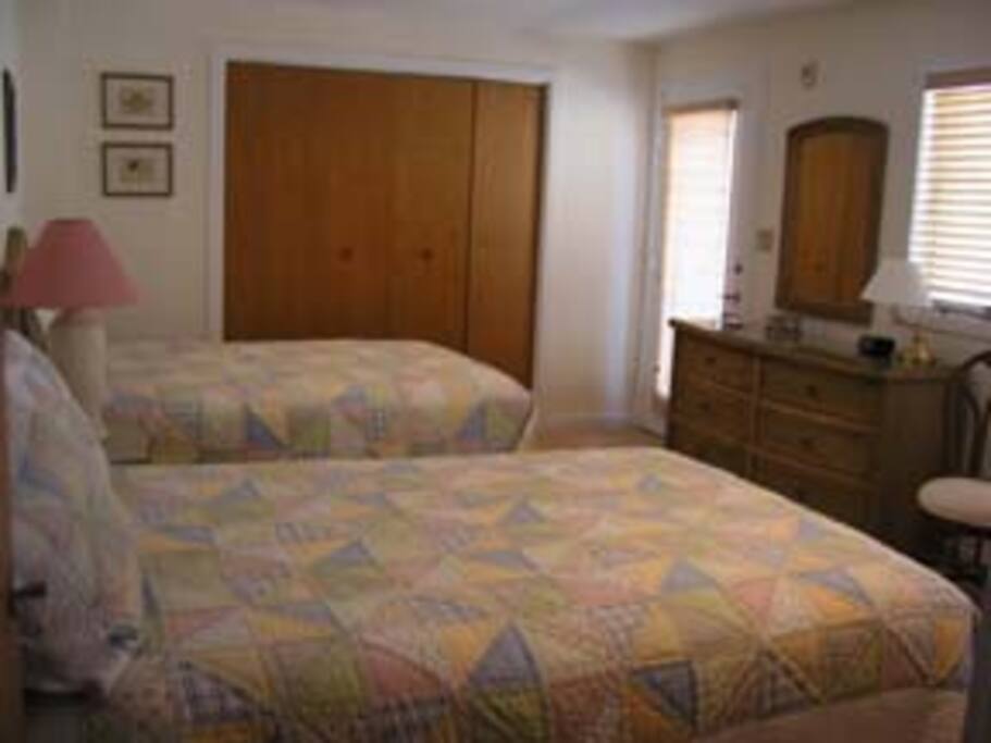 First floor bedroom with 2 full beds, private deck and full bath