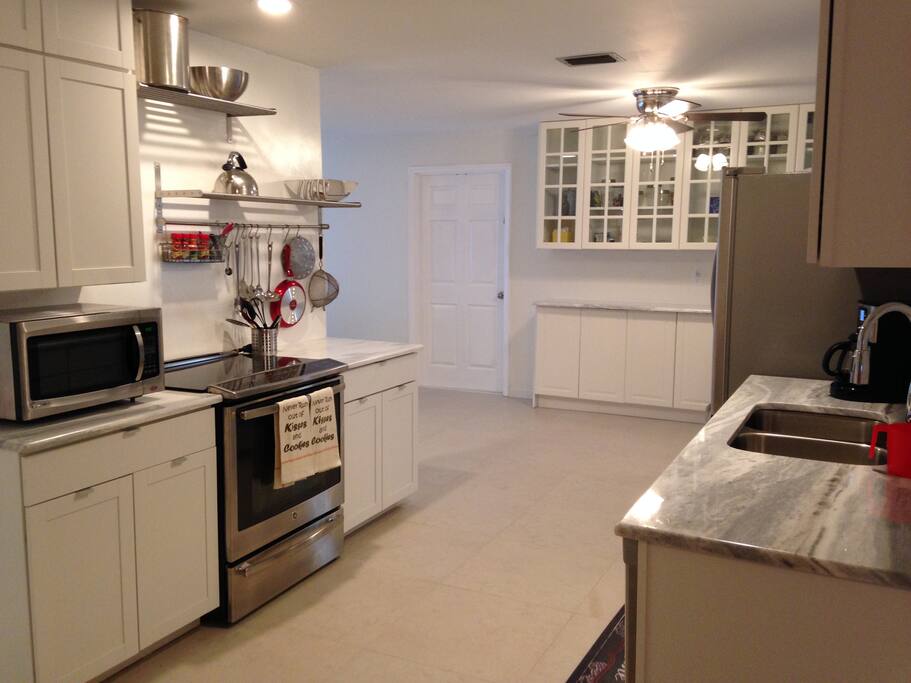 Huge chef kitchen recently updated with marble counters and stainless steel appliances