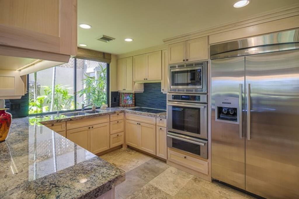 German engineered Thermador built-in kitchen with 48" fridge, gourmet oven, triple insulated dishwasher, easy to clean ceramic cooktop, Bosch washer/dryer, Deep Sinks, Granite counters, cool kitchen tools, beautiful china and glassware.