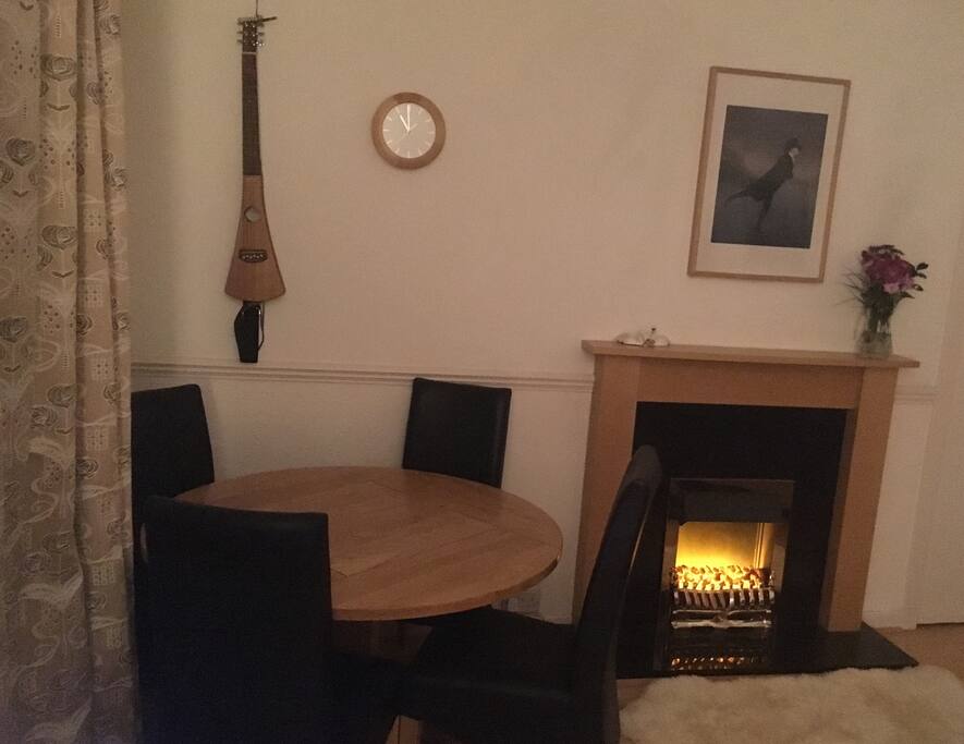 The living room. A cozy fire and a nice backpacker’s guitar for strumming. Bliss.