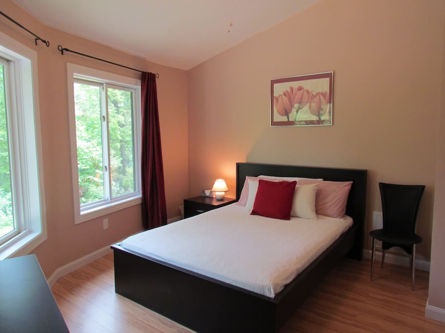 The queen bed in this private and serene bedroom has been described as "very comfy."
