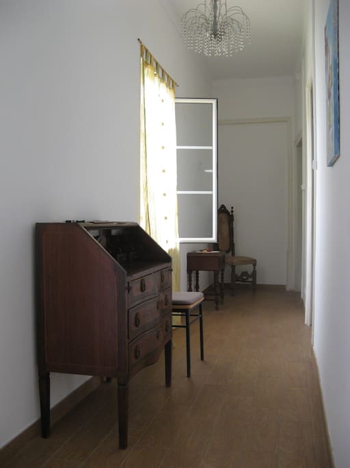 Hallway with window to quintal