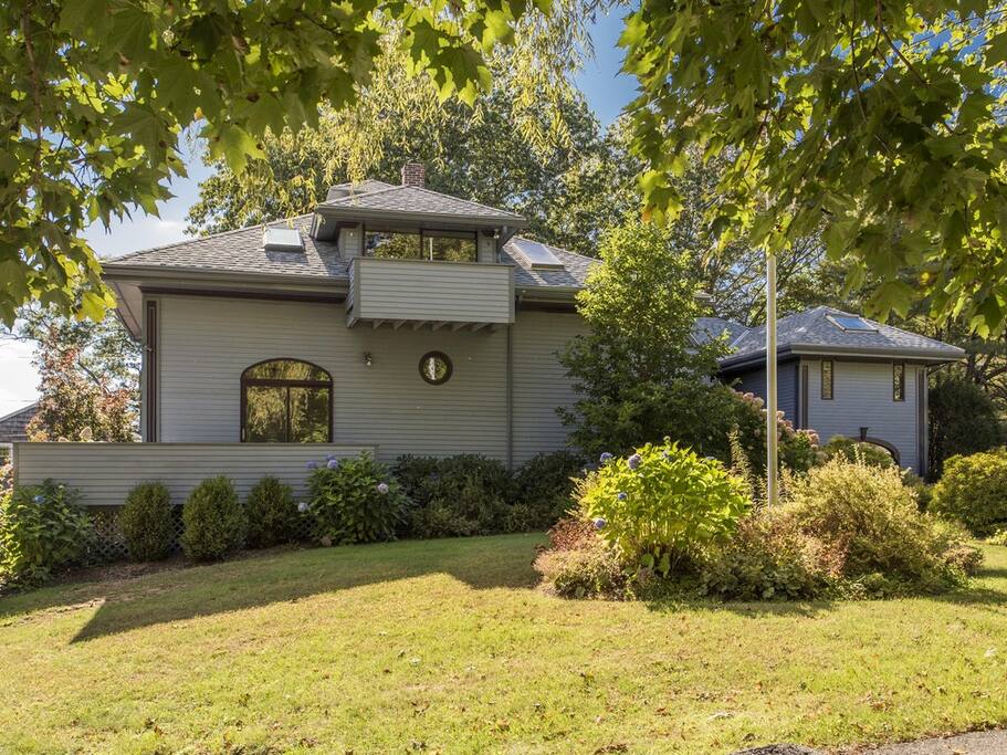 Home is listed on the National Register of Historic Places. Designed by John Calvin Stevens and built in 1912 as a carriage house and dairy barn