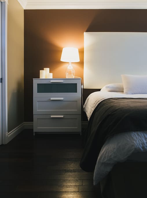 Night table next to bed