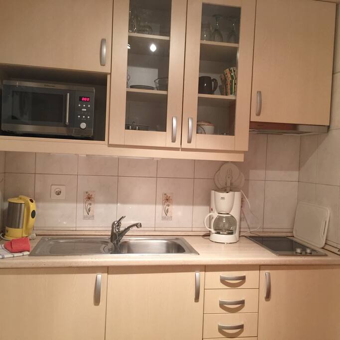 Cozy kitchen, microwave, ceran stove, coffe mashine, water cooker, plates, glasses, essentials.