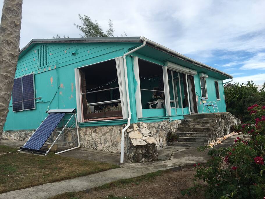 Side of house, solar panels heats the water.