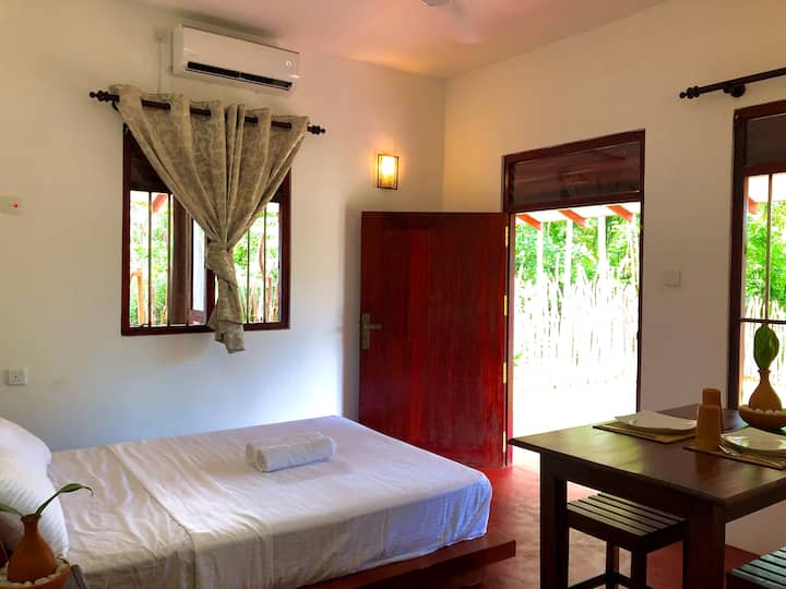 An awesome setup for those looking to enjoy a few days away or a longer stay...comfortable Queen-sized bed...air conditioned with table and chairs for dining/working...a bar fridge and kettle for that oh sweet Sri Lankan plain tea