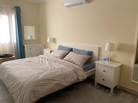 A modern private bedroom with attached bathroom