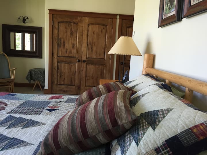 New king bed in guest bedroom #1 overlooking dock and water