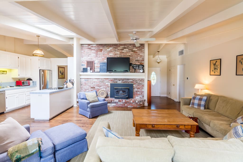 The casual living room seats 8 on plush furniture.