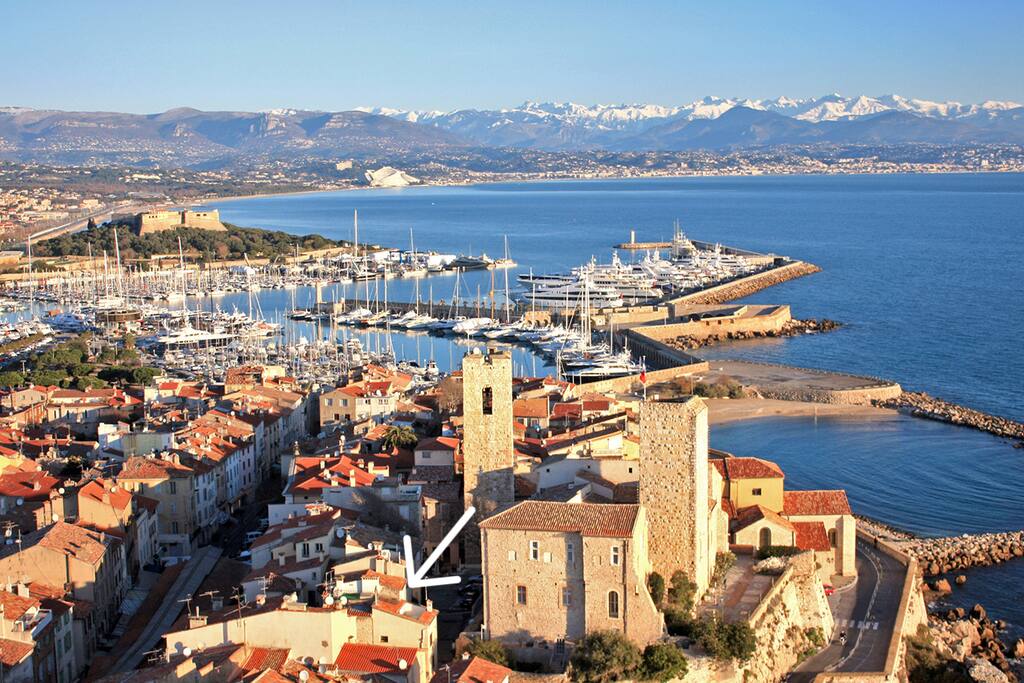 The old town of Antibes with a view over the marina bay