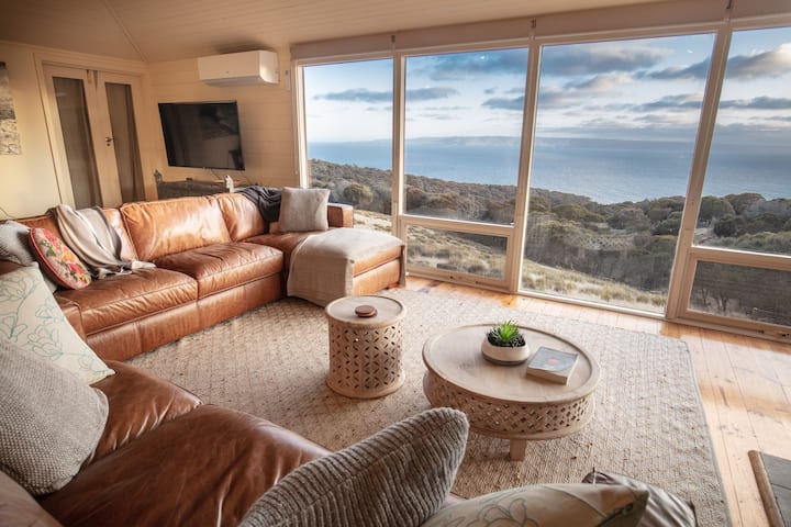 Cosy living room from which to enjoy a panorama across the wilderness and ocean, to the distant mainland 